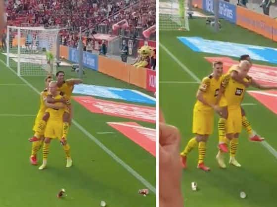 Article image:Jude Bellingham's epic beer catch after Erling Haaland's penalty for Dortmund