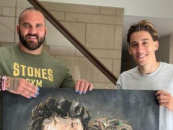 Article image:Artist presents brilliant artwork to Kostas Tsimikas after depicting him alongside Liverpool teammate in FA Cup victory