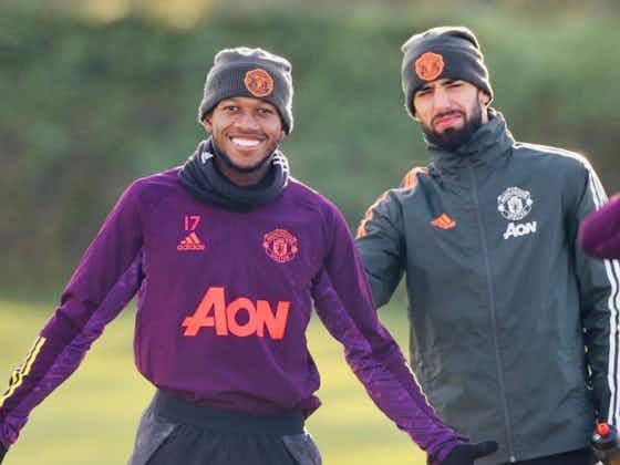 Article image:(Photo) Fred and Fernandes joke around during United training