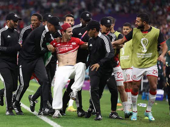 Article image:Pitch invader runs on with Palestine flag during Tunisia vs France at World Cup