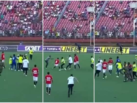Article image:Mohamed Salah gets military escort as security fight with pitch invaders during Egypt win