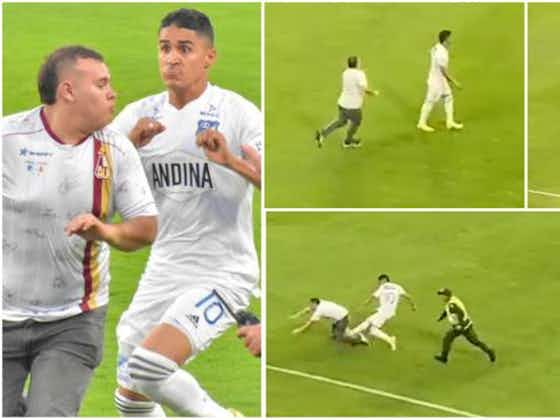 Article image:Football fan attacks player on the pitch but regrets it instantly