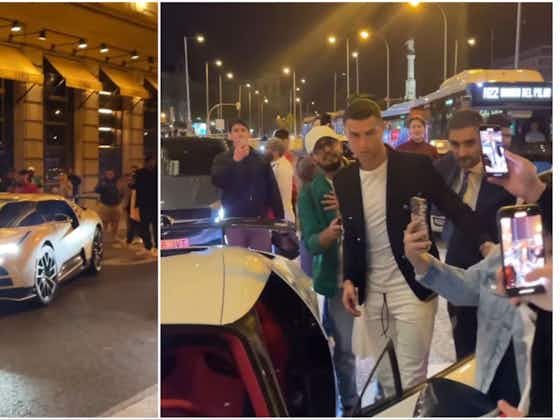 Article image:Cristiano Ronaldo mobbed by fans while driving £8.8 million limited edition supercar in Madrid