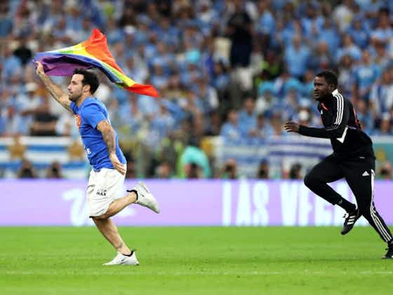Article image:Portugal v Uruguay paused as pitch invader enters with rainbow flag 🏳️‍🌈