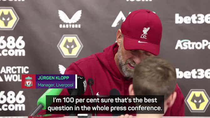 Preview image for Endearing Klopp signs kid's shirt during news conference