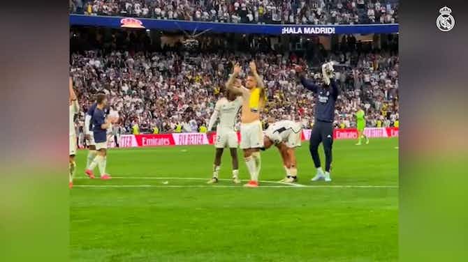 Preview image for Real Madrid players celebrating in front of fans before becoming LaLiga champions