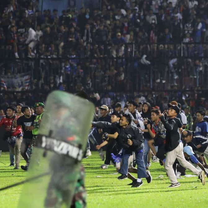 Preview image for At least 125 people die in football stadium crush in Indonesia following ticket oversell