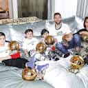 Preview image for Lionel Messi and his family pose with his seven Ballon d’Or awards in Paris