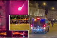 Preview image for Video: Bottles and flares thrown as riot police try to contain thousands of Rangers fans in Seville