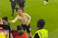Preview image for (Video) Shocking moment one supporter takes Henderson’s shirt from rightful owner as the captain throws shirt into the crowd